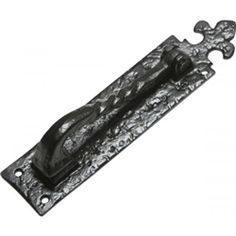 an ornate iron door handle on a white background