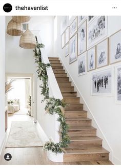 the stairs are decorated with greenery and pictures