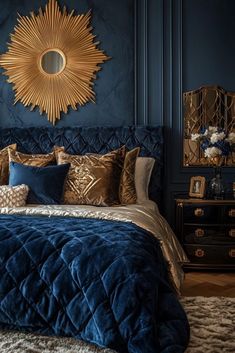 a bedroom with blue walls and gold accents