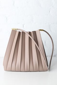 Carrie Pleated Vegan Shoulder Bag - Mushroom Taupe Shoulder Bag With Removable Pouch For On-the-go, On-the-go Taupe Shoulder Bag With Removable Pouch, Taupe Top Handle Bag With Handle Drop, Chic Satchel With Adjustable Handle And Bucket Shape, Chic Bucket Satchel With Adjustable Handle, Beige Hobo Bag With Adjustable Handle For Shopping, Shopping Shoulder Bucket Bag With Adjustable Handle, Taupe Shoulder Bag For Daily Use, Adjustable Handle Shoulder Bucket Bag For Shopping