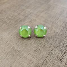 These lovely Lime Green Crystal Stud/Post earrings will add a touch of color to your look.  Lime crystals are set in Antique Silver and ready to ship. Perfect dressed up or down and great for gift giving. These earrings can be customized with your choice of color and finish. Please message me if you have a request. All items are Nickel free, hand set with care and guaranteed by me. Earrings Antique, Custom Earrings, Green Crystal, Green Earrings, Antique Earrings, Free Hand, Green Crystals, Post Earrings, Lime Green