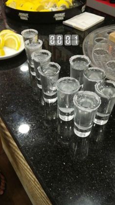 shot glasses are lined up on the counter