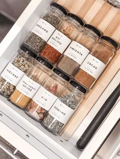 an organized spice rack with spices and seasonings