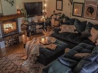 a living room filled with furniture and a fire place in the middle of the room