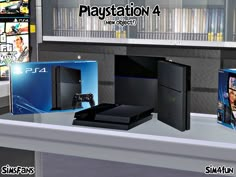 the playstation 4 console is on display in front of some other video game accessories and games