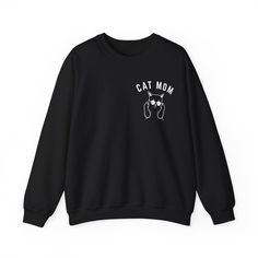 Cat Mom Sweatshirt, Funny Pet Lover Sweatshirt for Her, Cat Mama Sweatshirt for Mom Gift from Kids, Cat T-Sweatshirt Gift for Women 💫Ideal for any situation, a unisex heavy blend crewneck sweatshirt is pure comfort. 💫 Made with a medium-heavy fabric blend of 50% cotton and 50% polyester, this sweatshirt feels cozy and is the perfect choice for those colder months. 💫 Made using 100% ethically grown US cotton. Gildan is also a proud member of the US Cotton Trust Protocol ensuring ethical and su Winter Crew Neck Top With Cat Print, Trendy Long Sleeve Sweatshirt With Cat Design, Cat Design Cotton Long Sleeve Sweatshirt, Trendy Fall Sweatshirt With Cat Design, Casual Black Hoodie With Cat Print, Casual Hoodie With Cat Design And Crew Neck, Casual Crew Neck Sweatshirt With Cat Print, Streetwear Crew Neck Top With Cat Design, Relaxed Fit Long Sleeve Sweatshirt With Cat Print