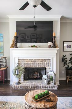 a living room with a fire place and a flat screen tv mounted above the fireplace