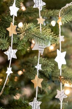 a christmas tree decorated with gold and white stars