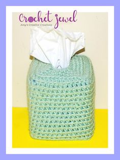 the cover of crochet journal features a blue basket with a tissue paper in it