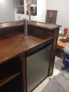 a kitchen counter with a dishwasher in it