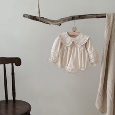 Introduce your little one to timeless elegance with this soft, breathable cotton-linen romper. The long sleeves and minimalist design make it ideal for year-round wear. Featuring a delicate natural texture, this romper combines simplicity with style for any occasion. Snap closures at the crotch ensure easy diaper changes. Features: Made from a premium blend of cotton and linen Snap closures for convenience Long sleeves for year-round versatility Natural, soft fabric perfect for sensitive skin Cream Long Sleeve Bubble Romper For Summer, Cream Long Sleeve Cotton Jumpsuit, Long Sleeve Cotton Bubble Romper, Cream Long Sleeve Jumpsuits And Rompers For Spring, Cream Long Sleeve Jumpsuits For Spring, Summer Cream Long Sleeve Jumpsuits And Rompers, Cream Long Sleeve Jumpsuits And Rompers For Summer, Cream Long Sleeve Jumpsuits For Summer, Bamboo Shop