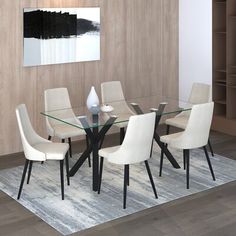 a glass dining table with white chairs and a vase on the rug in front of it