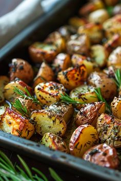 Roasted baby potatoes with herbs and rosemary sprigs on a baking tray. Meal With Roasted Potatoes, Fancy Dinner Sides, Rosemary Potatoes Roasted, Herbed Potatoes, Man Recipes, Roasted Baby Potatoes, Honey Lime Chicken