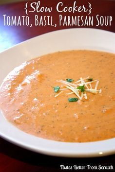 a bowl of soup with parmesan cheese on top and the words slow cooker tomato basil, parmesan soup