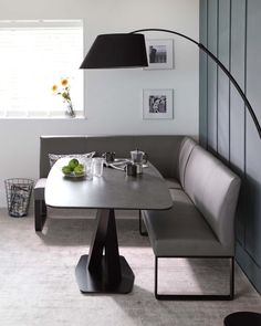 a table and bench in a room