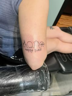 a woman's leg with the words happy place tattooed on it