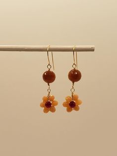 Sunstone, Ruby and Crystal Flower Cluster Briolette Dangle Earrings - Yellow Gold Filled, Rose Gold Filled, Sterling Silver, Bohemian, Boho These dainty earrings feature 7mm natural sunstone beads with a wire wrapped flower made of 4mm genuine ruby and beige crystals. Elegant and timeless for any occasion. Custom or similar piece can be made.  Earring closures upgrade available at additional cost (fleur de lis leverback, 4mm ball posts in same metal or 14k solid gold as well as 14k solid gold ea Orange Adjustable Dangle Flower Earrings, Adjustable Dangle Earrings With Flower Charm, Wire Wrapped Flower, Sunstone Earrings, Morganite Earrings, Silver Packaging, Flower Cluster, Small Gift Boxes, Moonstone Earrings