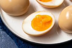 hard boiled eggs on a plate with one broken