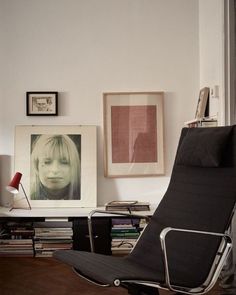 a black chair sitting in front of a window