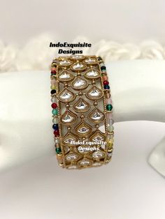 Multi color Kundan Kade/ Bracelet (Single Pc)/Indian bangles/Punjabi bangles Set/Bridal bangles/wedding jewelry/Indian Wedding jewelry/Kundan Polki bridal bangles All items are shipped from Brampton, Ontario, Canada. If you need your item by a certain day, please reach out to us for express delivery option. We kindly request to consider minor variations in colors, shades, textures as pictures displayed may slightly vary from the actual product due to digital image limitations. Please expect the possibility of some minor imperfections when buying handmade jewelry. Please contact us for any questions you might have. Thank you and Happy shopping 😊 Elegant Multicolor Cuff Bracelet For Festive Occasions, Fusion Style Bracelet For Wedding And Diwali, Fusion Style Bangle For Wedding And Diwali, Fusion Style Wedding Bracelet For Diwali, Multicolor Round Beads Bracelets For Weddings, Kundan Bracelets For Marriage And Festivals, Fusion Style Bangle For Festival Celebrations, Fusion Style Cuff Bangle Bracelet For Festivals, Traditional Stackable Bracelets For Party