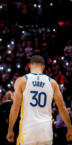 a basketball player with his back to the camera