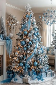 a decorated christmas tree with blue and silver ornaments