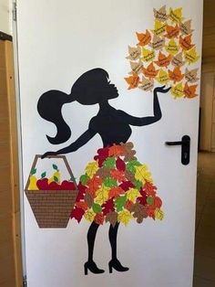 the door is decorated with an image of a woman holding a basket full of autumn leaves