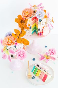 there is a cake on the table with flowers in it and one slice has been cut out