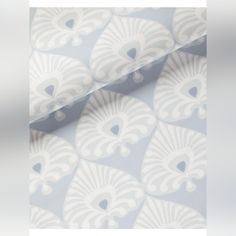 a wallpaper with white and blue designs on it