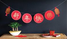 the table is decorated with red paper lanterns and decorations for chinese new year's day