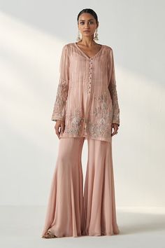 Blush pink kurta with hand embroidery on the sleeves and kurta hem. Paired with a sharara and bustier. - Aza Fashions Elegant Pink Salwar Kameez With Handwork, Pink Handwork Sharara For Eid, Pink Sharara With Handwork For Eid, Pink Anarkali Set With Handwork, Pink Anarkali Set With Handwork For Diwali, Pink Anarkali Set For Diwali With Handwork, Bollywood Style Pink Sharara With Handwork, Pink Bollywood Sharara With Handwork, Bollywood Pink Sharara With Handwork