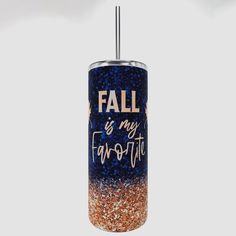 a blue and orange tumbler with the words fall is my favorite