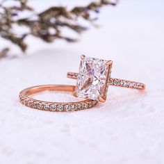 3.30ct Radiant Cut Moissanite Engagement Ring, Wedding Ring SetJewelry InformationBrand, Seller, or Collection Name: Charon JewelsMaterial: 14k Yellow gold, metalCenter Stone Type: Moissanite Setting: Prong-SettingStone DetailsStone Type = Radiant Cut Moissanite DiamondDiamond Size MM = 10x7 MMStone Weight= 3.30CtDiamond Shape = Radiant CutDiamond Color = ColorlessDiamond Clarity = VVS1Side Stones= Round Cut Moissanite DiamondsStone Weight= 0.100CtDiamond Shape =Round cutDiamond Color = ColorlessDiamond Clarity = VVS1Band Stones= Round Cut Moissanite DiamondsStone Weight= 0.150CtDiamond Shape =Round cutDiamond Color = ColorlessDiamond Clarity = VVS1The total approximate weight of stones: 3.55ctDiamond Creation = Lab-CreatedJewelry Type = Moissanite RingMetal = 14k Yellow goldMetal Purity= Radiant Cut Moissanite Engagement Ring, Moissanite Wedding Ring Set, Couples Ring, Engagement Wedding Ring Sets, Natural Diamond Ring, Colorless Diamond, Moissanite Wedding Rings, Men Diamond Ring, Bridal Bands