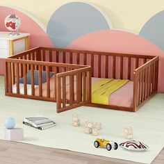 a baby's room with two cribs and toys on the floor in front of it