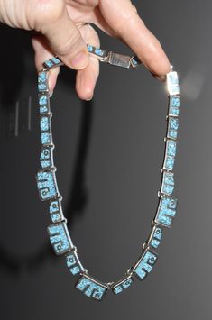 "Vintage Mexican Taxco Sterling Silver Crushed Turquoise Inlaid Linked Choker Necklace Crushed turquoise is inlaid in a modern design. Each link is connected with a solder jump ring. Choker length with a large push in box clasp. Marked on the center link MEXICO 925 STERLING ASE TAXCO The necklace is 15 1/2\" long. The large links are 1/2\" wide and the smaller links are 1/4\" wide. This is a pre-owned necklace in nice condition. 58.8 grams or 1.88 oz troy total weight Thanks for looking :)" Unique Blue Turquoise Inlay Necklace, Artisan Blue Turquoise Necklace With Inlay, Box Clasp, Upcycled Jewelry, Watch Chain, Vintage Mexican, Victorian Jewelry, Vintage Pins, Photo Jewelry