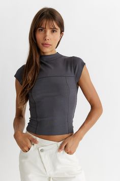 - Exposed seams with contrast stitching -Cropped, ribbed tee with silhouette fit -Mock neck Mock Neck Top Outfit, Contrast Stitch Top, Mock Neck Short Sleeve, Ribbed Tee, Mock Neck Tank, Exposed Seams, Skirt And Blouse, Clothes Sewing Patterns, Mock Neck Top