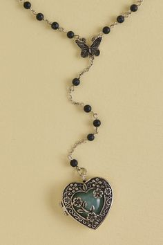 <p>Awaken the heart with this adorable heart-shaped magnetic locket pendant necklace that opens and reveals a faux green crystal heart inside. Along the adjustable necklace chain includes black mini balls for an antique feel. What makes this necklace a standout is the dropped lariat chain center that adds elegance and regal vibes to any look! </p> Locket Pendant Necklace, Party Dresses Online, Green Heart, Dope Jewelry, Funky Jewelry, Jewelry Lookbook, Green Crystal, Heart Locket, Girly Jewelry