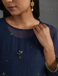 A straight-cut kurta in cotton silk fabric with all-over floral buttis made using beads, sequins and silk French knots. Kurta, pants and dupatta have a lace edging at the hem, side cut, and sleeve ends. Bead work runs along the neckline and in between lace patterns. Delicate pin tucks stitched across the organza dupatta with embroidered scalloped edges and machine stitches in between pin tucks. Elasticated waist comfortable fully lined pants with draw strings. Kurta measurements (in Inches): Siz Diwali New Year, Kurta Pants, French Knot Stitch, French Knot Embroidery, Cotton Silk Fabric, Embroidery Videos, Indigo Colour, French Knots, French Knot