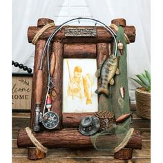 a wooden frame with fishing related items on it