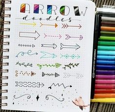 a notebook filled with lots of different colored markers