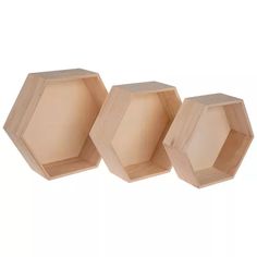 three wooden hexagonals are lined up against each other on a white background