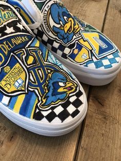 Custom, hand painted slip on Vans   University of Delaware Blue Hens sneakers.  Can be done in Converse with your school or logo! Contact me to create your custom pair! Blue Custom Artwork Sneakers, Custom Hand Painted Blue Sneakers, Custom Blue Hand Painted Sneakers, Blue Custom Artwork High-top Sneakers, Blue High-top Sneakers With Custom Artwork, Blue Custom Artwork Sneakers With Round Toe, Blue Custom Sneakers With Artwork And Round Toe, Blue Sporty Custom Hand Painted Sneakers, Artistic Custom Blue Sneakers For Streetwear