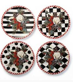 four black and white plates with roses on them, all decorated in red and white stripes