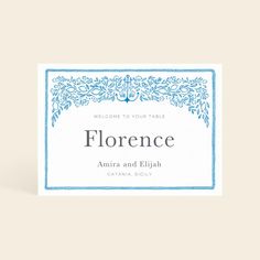 a place card with the word, florence in blue and white on it