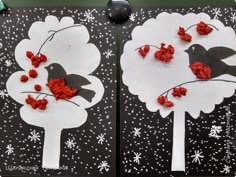 two paper trees with red flowers on them