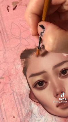 a person is painting a woman's face with a pencil