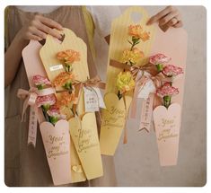 two tags with flowers are attached to each other