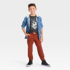 Upgrade your child's collection of casual bottoms with these Stretch Woven Jogger Pull-On Pants from Cat & Jack™. They can relax or move about in comfort and style thanks to these cotton stretch joggers with reinforced knees to keep up with their active lifestyle, and a flexible drawcord on the elasticized waist as well as elastic cinching on the ankle cuffs for a stay-put fit. Multiple side and back pockets complete the design with functional flair. Cat & Jack™: Classics with an imagination of Casual Cotton Joggers For Fall, Casual Bottoms, Boy Poses, Shipt Shopper, Fabric Tape, Pull On Pants, Pair Of Pants, Tapered Legs, Casual Fits