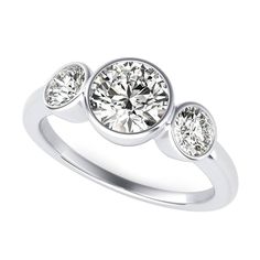 three stone diamond ring in white gold with diamonds on the sides and an oval setting