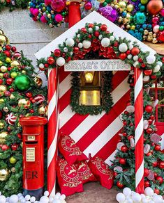 a red and white house decorated with christmas decorations